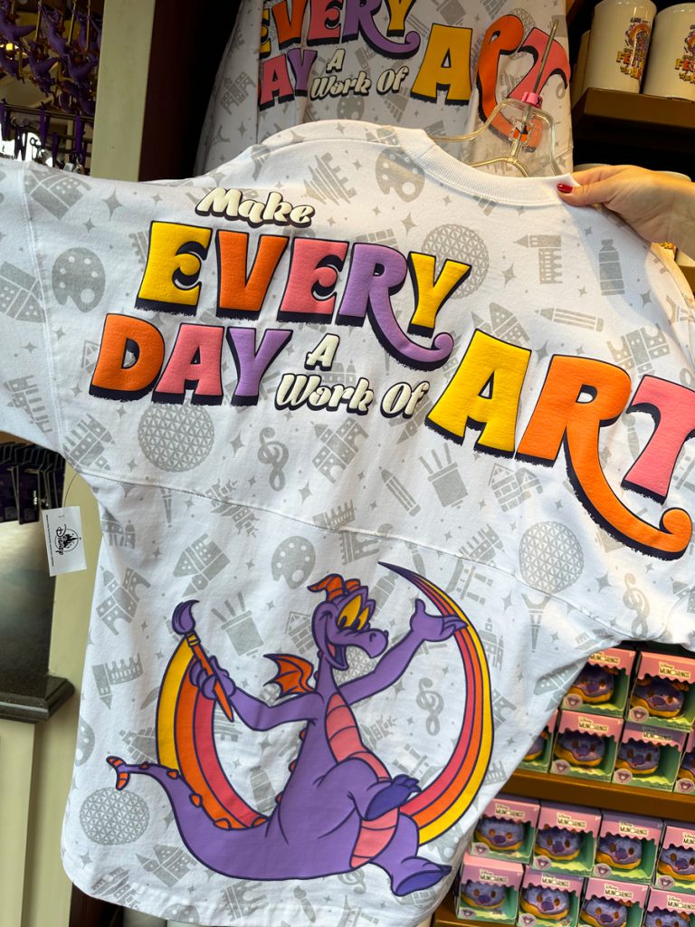 Image of Figment spirit jersey back featuring Figment painting a rainbow and font reading Make Every Day A Work of Art
