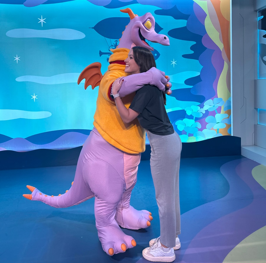 Image of Figment meet and greet with guest hugging during 2024 EPCOT International Festival of the Arts