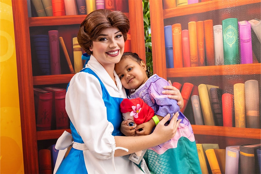 Belle with a girl in an Ariel-inspired hospital gown