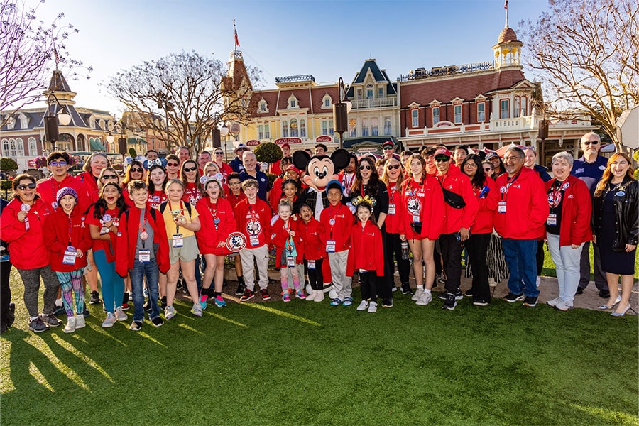 Mickey Mouse with members of Tragedy Assistance Program for Survivors at Magic Kingdom Park