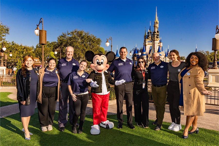 Mickey Mouse with members of Disney SALUTE veteran employee resource group at Magic Kingdom Park