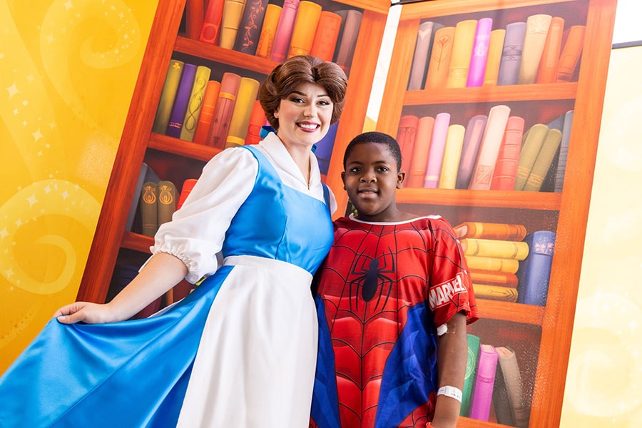 Bell with a boy in a Spider-Man-inspired hospital gown 