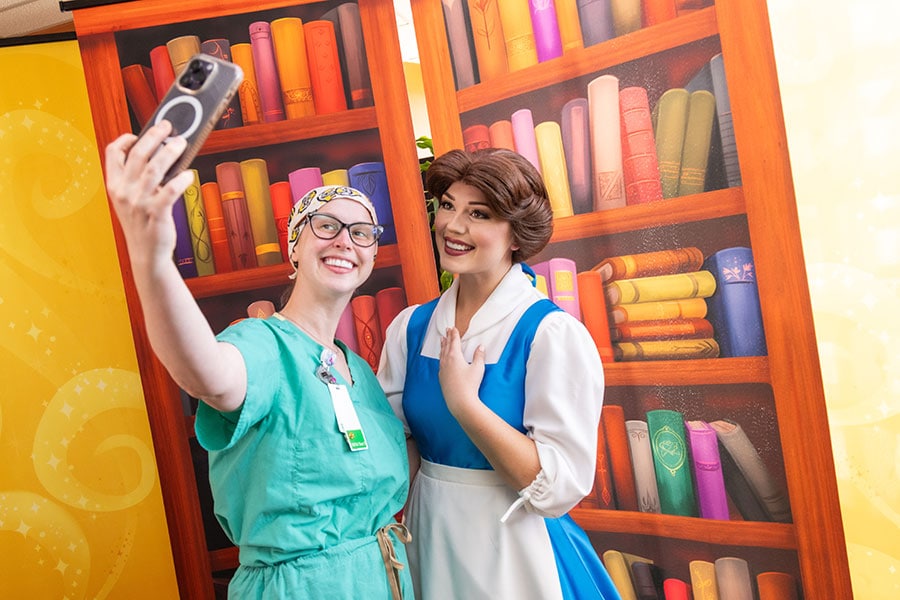 Belle taking a selfie with a hospital employee