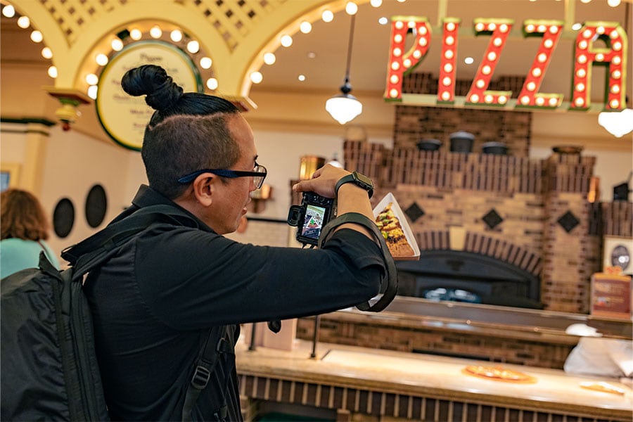 Disney cast member David photographing food at the Disneyland Resort