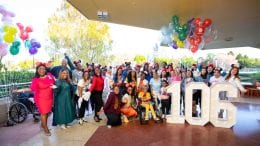 Group photo of people celebrating the Magnolia Jackson 106th Birthday at Magic Kingdom