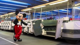 Mickey Mouse is seen gesturing to the parking lot tram at the Disneyland Resort