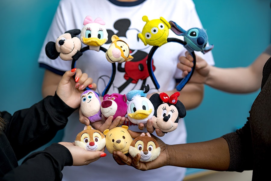 people holding Disney mini plush accessories to create your own personalized headband