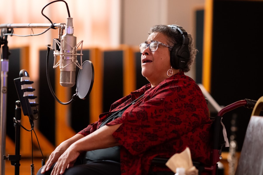 Chase family member recording for Tiana’s Bayou Adventure, Leah Chase Jr., covers the Louis Armstrong song, “Do You Know What It Means to Miss New Orleans?”.