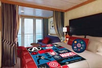 Be someone's hero when you amaze them with these Disney Cruise Line room decorations! A Disney Cruise Line stateroom with an Avengers pillow and blanket on the bed