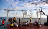 Disney Counselors Instruct Children in a Sports Game on the Ship's Sports Area on Deck