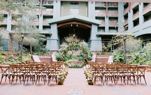 Many chairs face a gazebo in an outside courtyard Many chairs face a gazebo in an outside courtyard