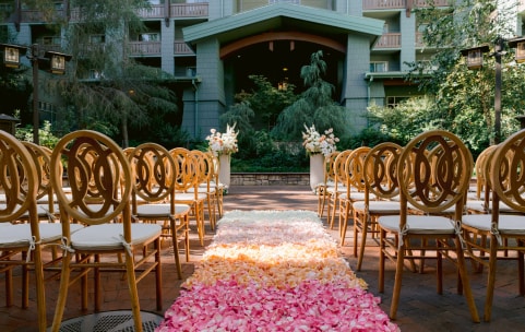A wedding ceremony aisle covered in rose petals at Disney's Grand Californian Hotel and Spa