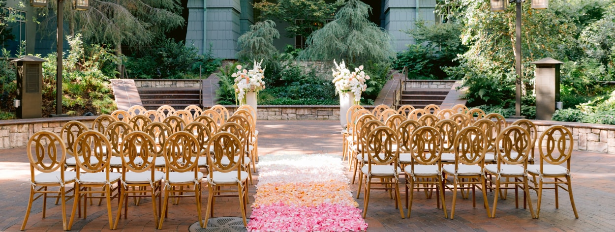 A wedding ceremony aisle covered in rose petals at Disney's Grand Californian Hotel and Spa