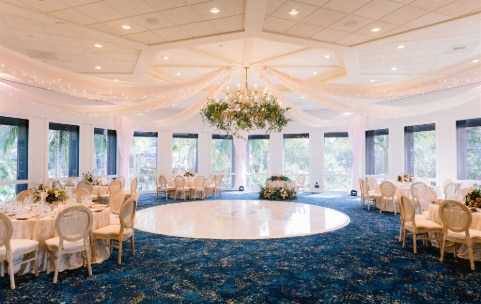 Many chairs face a gazebo in an outside courtyard Many chairs face a gazebo in an outside courtyard