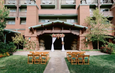 Many chairs face a gazebo in an outside courtyard Many chairs face a gazebo in an outside courtyard