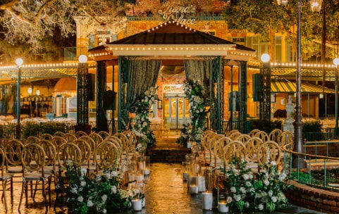Many chairs face a gazebo in an outside courtyard Many chairs face a gazebo in an outside courtyard