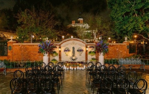 Many chairs face a gazebo in an outside courtyard Many chairs face a gazebo in an outside courtyard