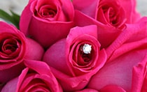 A diamond wedding ring in a rose bouquet