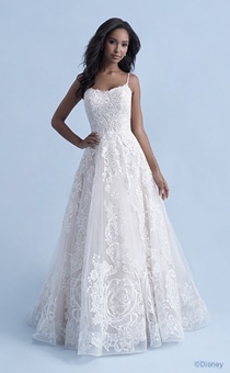 A woman wearing the Belle wedding gown from the 2021 Disney Fairy Tale Weddings Collection