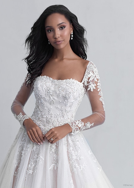 A woman in the Belle wedding gown from the 2021 Disney Fairy Tale Weddings Platinum Collection