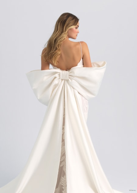 The back of a sleeveless wedding dress featuring a large bow on the back inspired by Rapunzel from Tangled