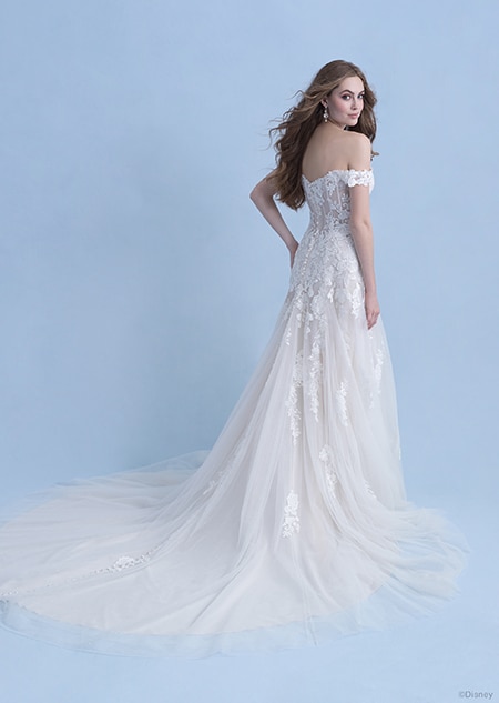 A back side view of a woman in the Aurora wedding gown from the 2021 Disney Fairy Tale Weddings Collection