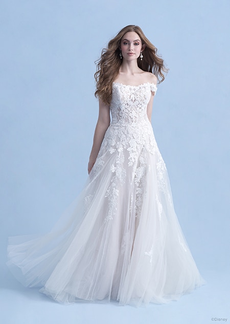 A woman dressed in the Aurora wedding gown from the 2021 Disney Fairy Tale Weddings Collection