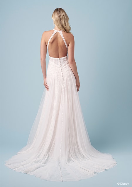 The back of a bride wearing a Pocahontas inspired A line gown featuring an exposed back