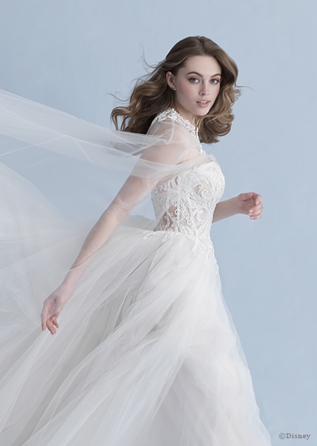A side view of a woman in the Aurora wedding gown from the 2020 Disney Fairy Tale Weddings Collection