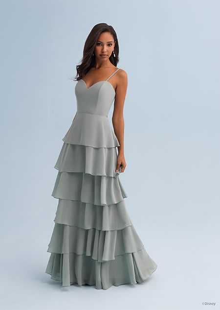 A woman wearing a Tiana themed bridesmaid dress with a sweetheart neckline with spaghetti straps