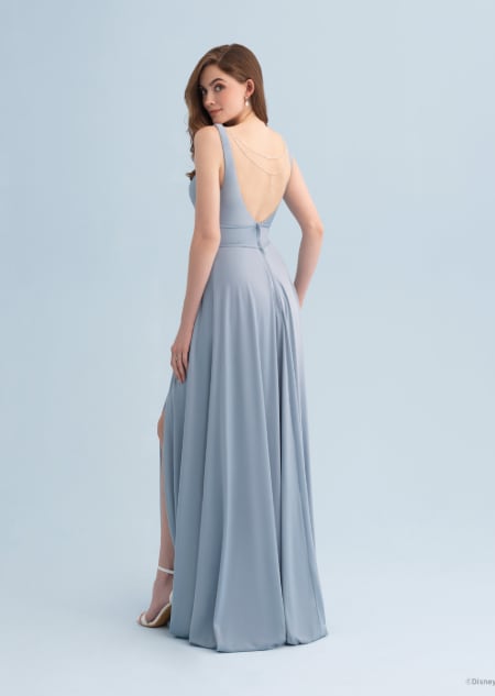 The back of a woman wearing a backless Ariel themed bridesmaid dress
