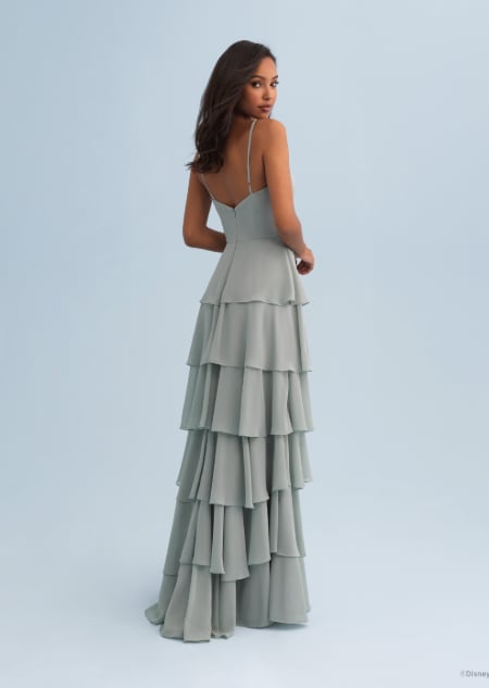 The back of a woman wearing a Tiana themed bridesmaid dress with ruffles and spaghetti straps