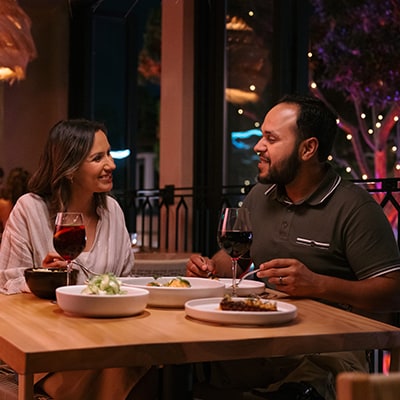 A couple dining at Paseo in Downtown Disney District