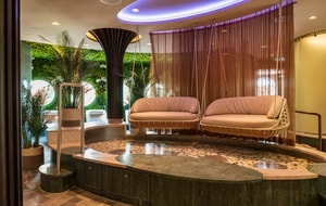 Two suspended sofas above a very shallow pool at Senses Spa & Salon