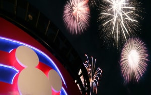 Fireworks exploding over a Disney cruise ship