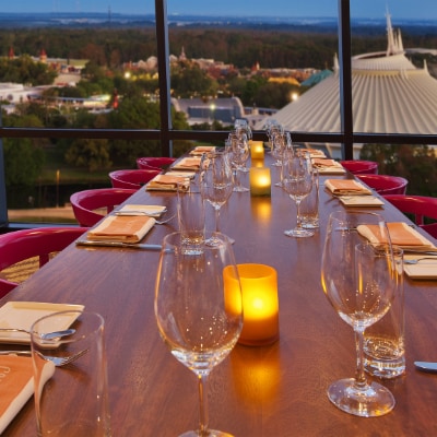 A dining table with a view of Magic Kingdom at California Grill