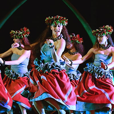 Hula dancers performing at Ka Wa’a, A Lu’au on Oahu at Aulani, A Disney Resort & Spa