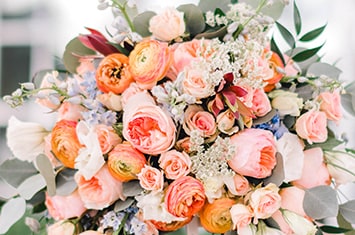 A bouquet featuring an assortment of roses and other flowers