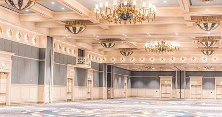 A spacious ballroom with chandeliers