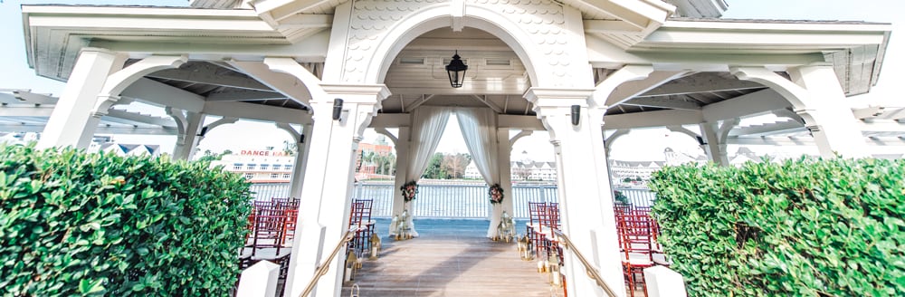 Steps leading up to a large gazebo holding rows of chairs and an altar