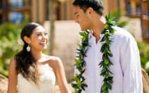 Newlyweds smiling at each other in a special moment captured by a Disney Photographer on their wedding day