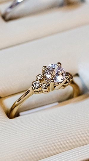 Close up of diamond wedding ring with gold band