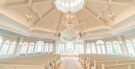 Rows of pews lining the aisle of the Disney Wedding Pavilion at Walt Disney World Resort