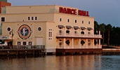 The exterior of the Atlantic Dance Hall, next to a lake
