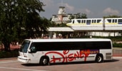 A Disney motorcoach in front of the monorail by the Main Entrance of Magic Kingdom park