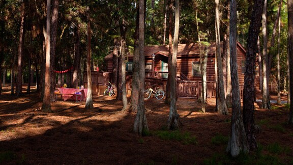 A cabin and picnic table at The Cabins at Disney's Fort Wilderness Resort in Florida