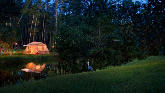 A tent by the water at The Campsites at Disney's Fort Wilderness Resort in Florida