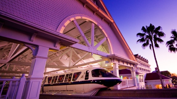 A monorail glides out of a station at Disney's Grand Floridian Resort & Spa