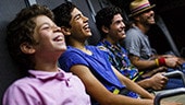4 teenage boys laughing