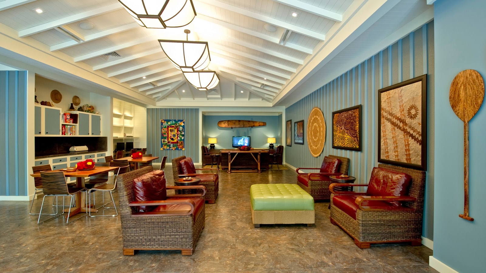 A lounge area with 2 tables and several chairs